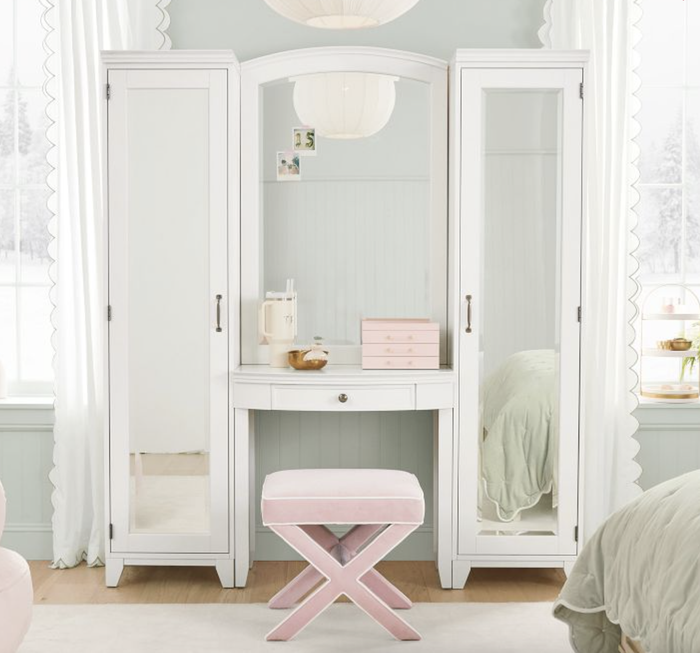 Vanity set featuring mirrored cabinets and a cushioned stool, ideal for storing and applying makeup, highlighted in a shopping article
