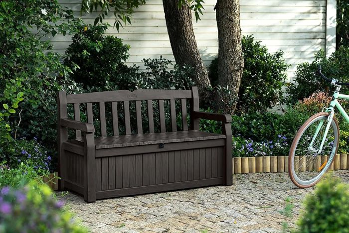 a dark brown bench with a storage box underneath