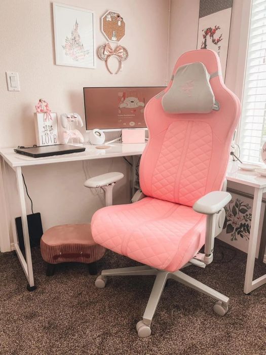 reviewer's pink gaming chair at their workstation