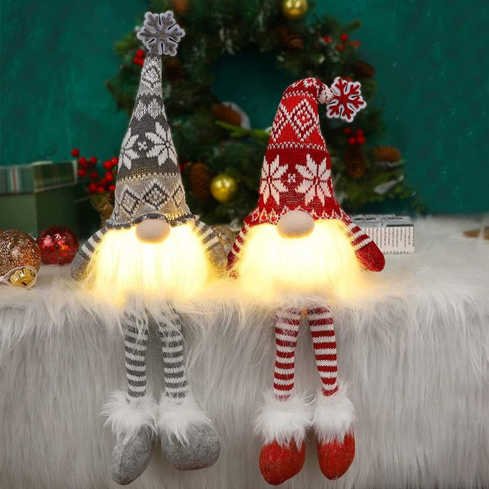 the same gnomes glowing with festive lights