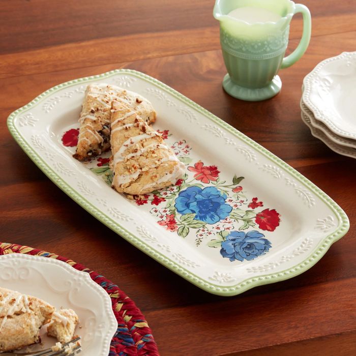 A floral-patterned tray topped with delicious scones, ready for serving.