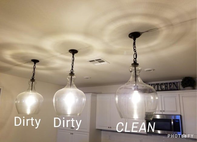 Three glass pendant lights: two are cloudy, while one shines clean and bright.