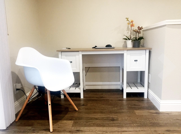 Side view highlighting the chair's armrests.
