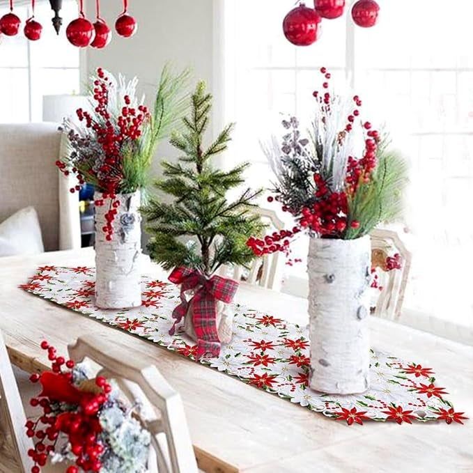 The table runner laid out on a white table, adorned with vases of flowers