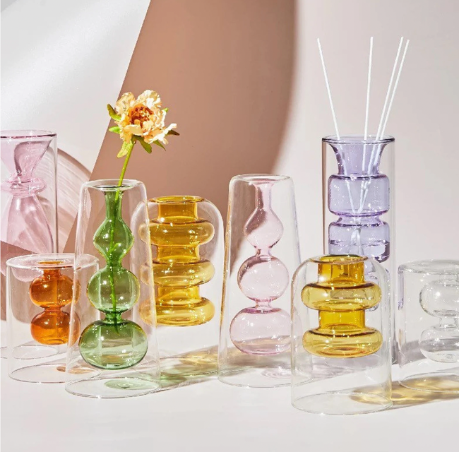 Glass vases featuring intricate inner colored curved glass details.