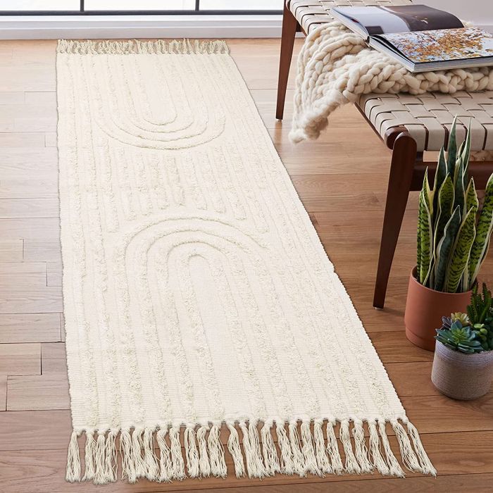 the beige runner positioned next to a bench and some plants