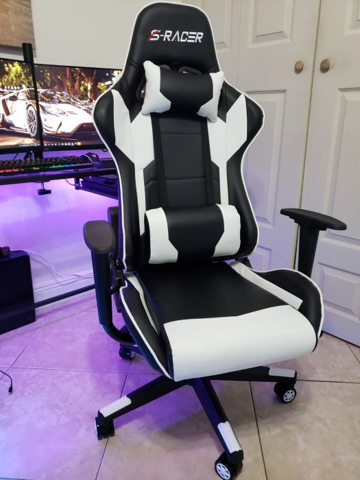 Ergonomic gaming chair with adjustable armrests, set in a modern and stylish home office