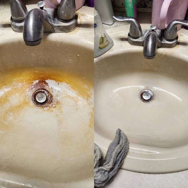 A reviewer's before-and-after photo of a white sink, showing orange, rusty stains before cleaning, and a gleaming, restored white sink afterward.