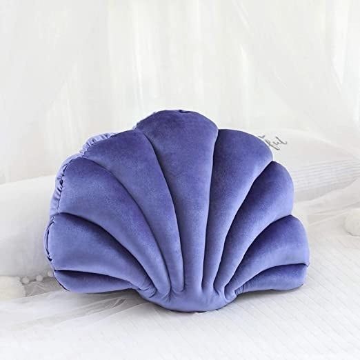 the purple variant of the seashell pillow