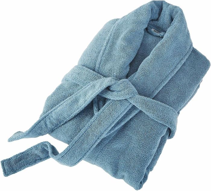 A neatly folded bathrobe in a calming blue color.