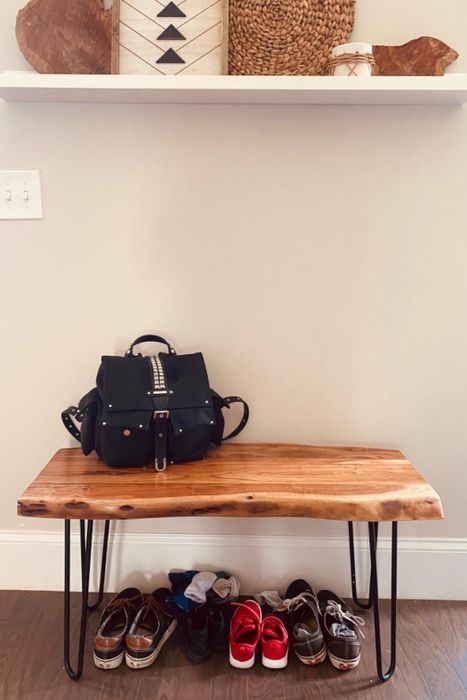 A reviewer’s photo of the bench being used in an entryway
