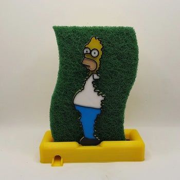 a sponge holder featuring Homer Simpson holding a green sponge