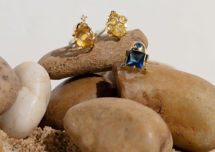 Three earring studs featuring R2-D2, C-3PO, and BB-8 from 