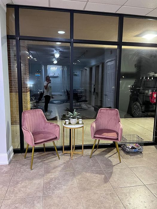 A reviewer's photo of the pink chairs in their office setting