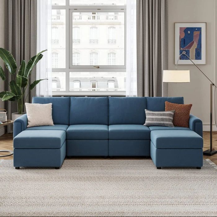 a U-shaped navy sofa with upright pillows in a stylish living room