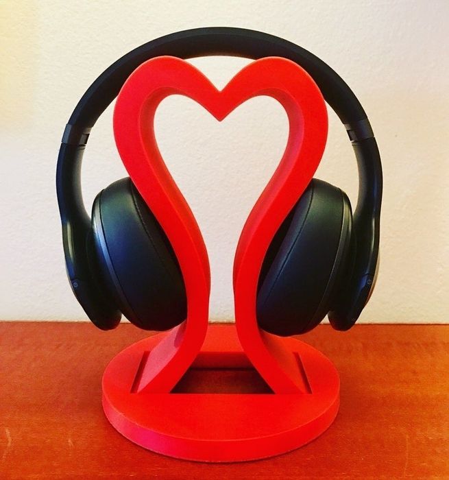 A red heart-shaped headphone stand.