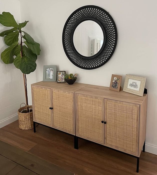 A reviewer's photo of the sideboard placed under a mirror