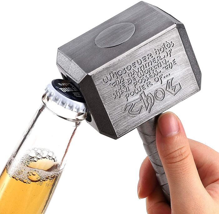 product image of the bottle opener in action, opening a beer bottle