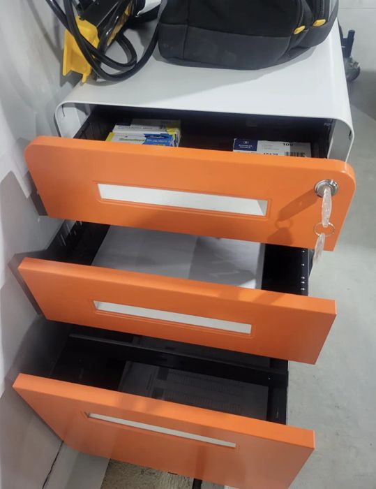 a reviewer’s file cabinet in vibrant orange