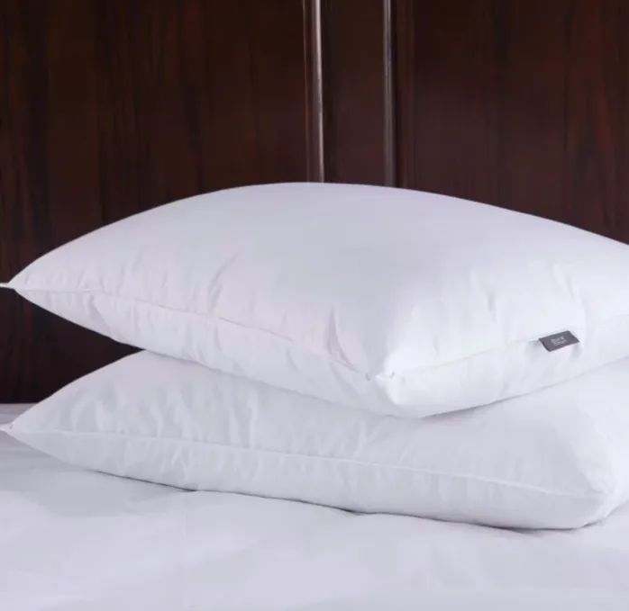 A pair of medium-loft pillows stacked neatly on top of one another.