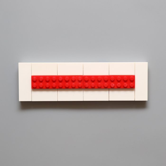 Red Lego key holder without any keychains attached