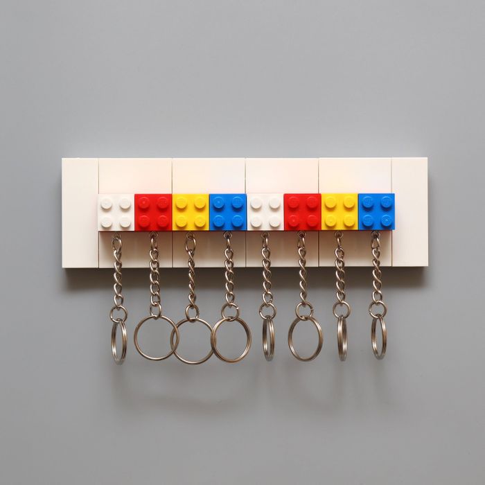 Colorful Lego keychains arranged on a key holder