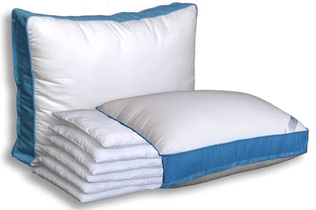 Two pillows with blue stripes, one stacked on top of slanted pillows, shown in a shopping article.