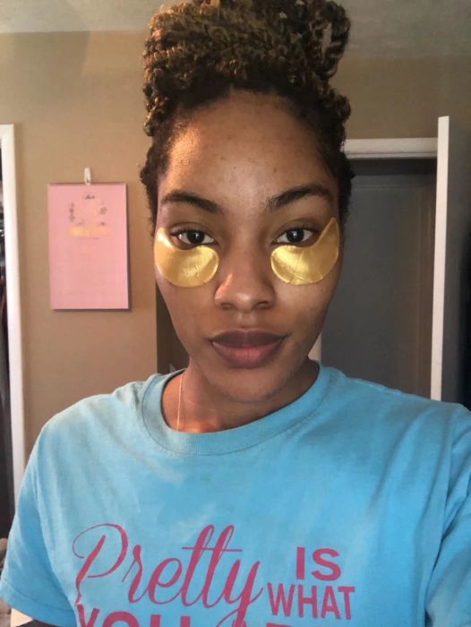 Reviewer wearing under-eye patches from Le Gushe.