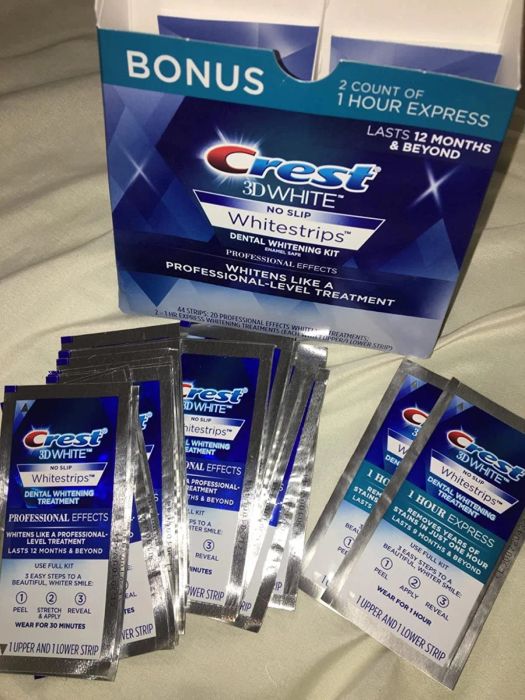 A reviewer's Crest whitening strips neatly arranged in front of the product box.
