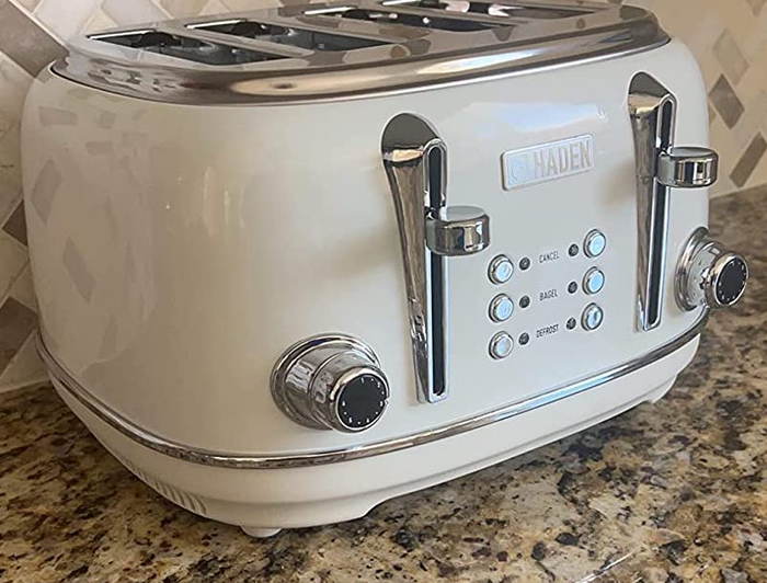 Reviewer photo of a white vintage-style toaster on a countertop