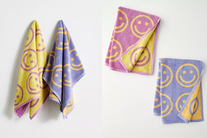 Yellow and purple double-sided towels featuring smiling faces