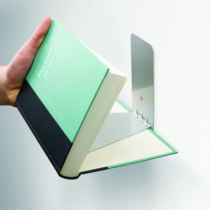 The invisible shelf placed to hide the cover of a book