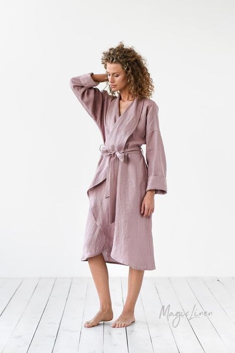 A model wearing a knee-length robe