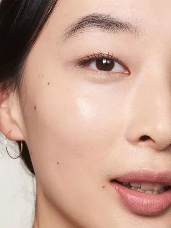 An Asian model with beautifully glowing skin.