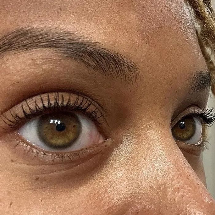 A close-up shot of a reviewer's lashes coated in mascara.