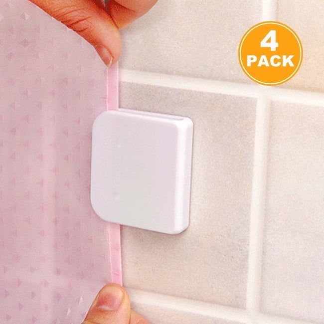 Hands placing a shower curtain into a white square holder mounted on a tile surround