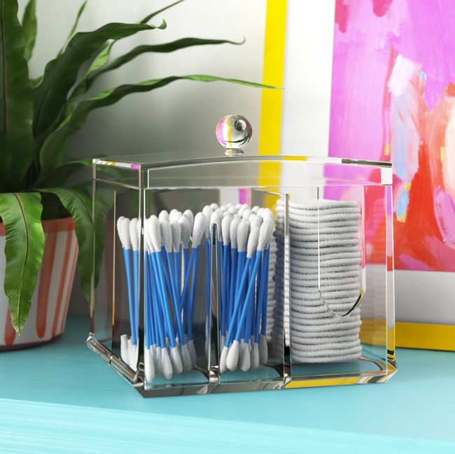 Acrylic container filled with cotton swabs and rounds