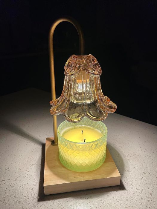 A lamp melting a two-wick candle