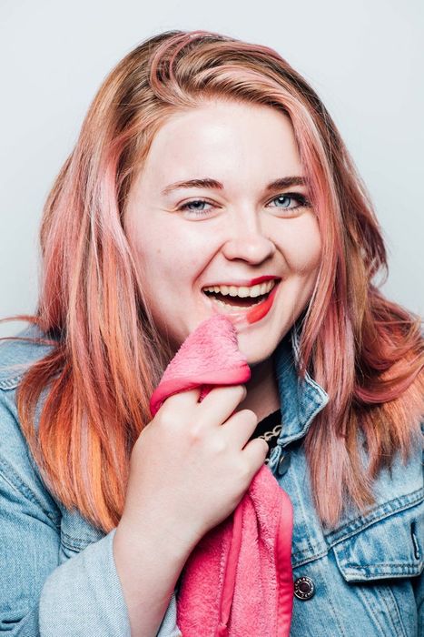 A person with half of their makeup removed using the Makeup Eraser