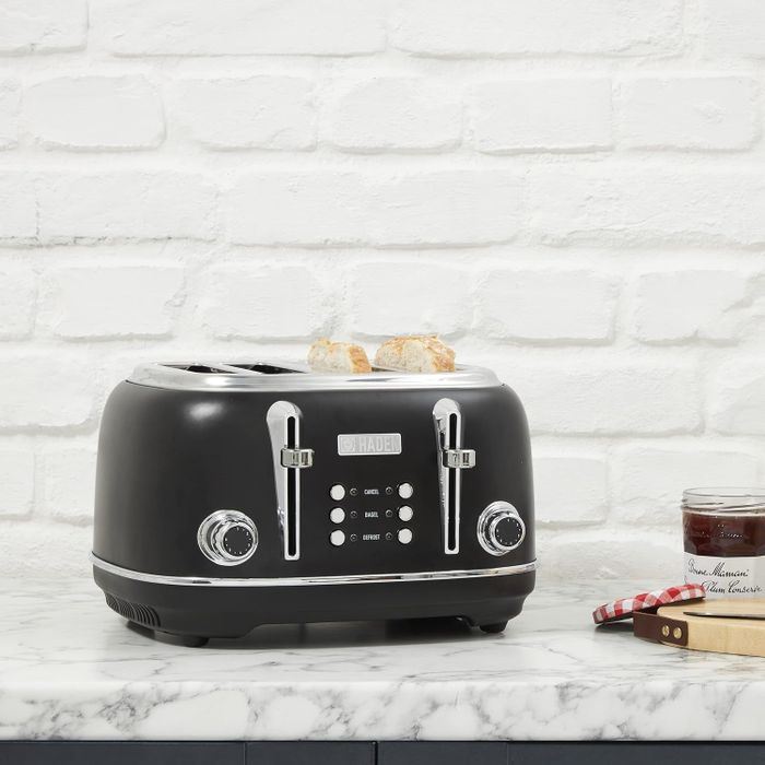 The sleek black toaster sitting on a kitchen counter