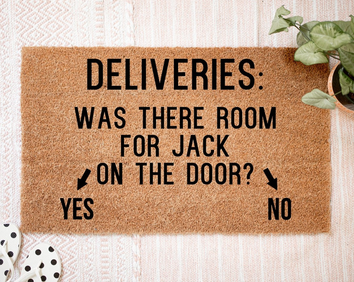 A doormat with the phrase 'deliveries: was there room for jack?' displayed on the door