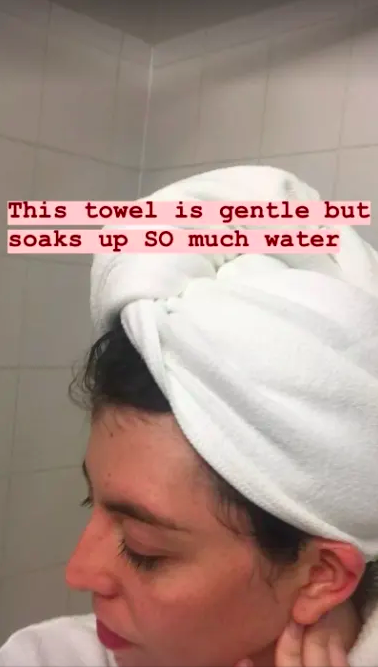 A person wearing the towel, with a text overlay.