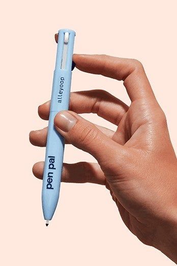 A model holding the Pen Pal product