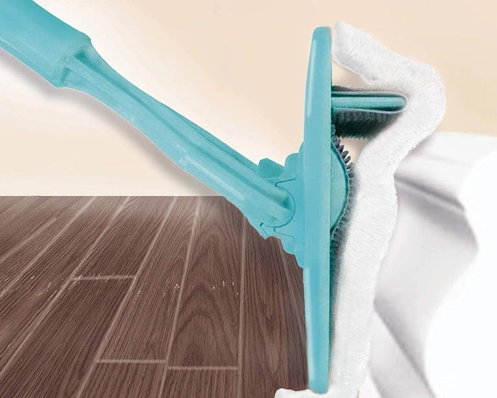 A baseboard cleaning tool in action