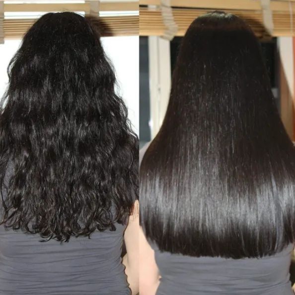 A reviewer showcasing the transformation from wavy to super-sleek, shiny straight hair