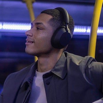 model sporting the headphones in black