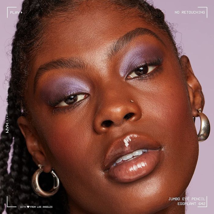 A model rocking the shimmering purple eyeshadow