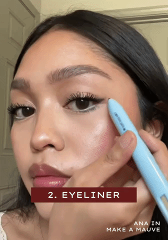 A gif of someone applying the pen on their eyes and lips
