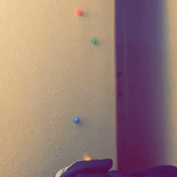 Reviewer's video demonstrating the sticky balls gliding down the wall