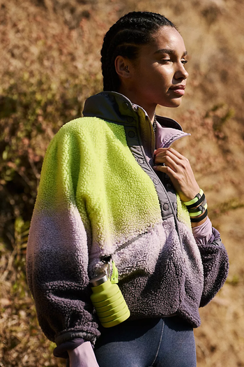 model showcasing the green and purple ombre fleece jacket
